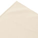 A bone Snap Drape box pleat table skirt on a white surface.