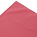 A dusty rose table skirt with a white box pleat edge.