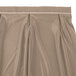A beige Snap Drape table skirt with bow tie pleats.