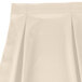 A white Snap Drape table skirt with pleats on it.