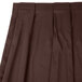A brown Snap Drape box pleat table skirt with velcro clips.