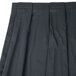 A close-up of a slate blue box pleat Snap Drape table skirt.