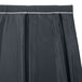 A black box pleat table skirt with white trim on a white background.