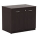 A black Alera Valencia storage cabinet with silver handles, two doors, and two drawers.