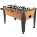 An Atomic Pro Force foosball table with black and white knobs.