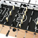 A close up of an Atomic Pro Force foosball table with black and white handles.
