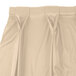 A cream Snap Drape table skirt with bow tie pleats and Velcro clips.