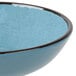 A close up of a blue Elite Global Solutions crackle bowl with a black rim.