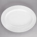 A white Libbey Royal Rideau porcelain platter with a rim on a gray surface.