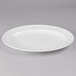 A white Libbey Royal Rideau porcelain platter with a rim.