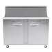 A large stainless steel Traulsen sandwich prep table with 1 left hinged and 1 right hinged door.