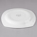 A white Libbey porcelain plate with a circular design on it.