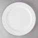 A white Libbey porcelain plate with a white rim on a gray surface.