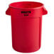 A red Rubbermaid Brute trash can with black text.