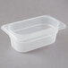 A clear plastic Cambro food pan with a lid.