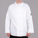 A man wearing a white Chef Revival chef coat with a bronze button.