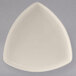 A white triangle shaped Tuxton eggshell china plate.
