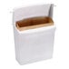 A white Rubbermaid trash can with a brown paper inside.