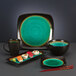A set of Libbey stoneware dip dishes with sushi on a plate.