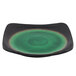 A black and green Libbey stoneware plate with round detailing on the rim.