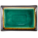 A green rectangular Libbey stoneware platter with brown specks on the border.