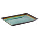A Libbey rectangular stoneware platter with a blue surface and a green and yellow rim.