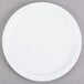 A white Carlisle Kingline plate with a white rim on a gray surface.
