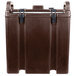 A dark brown plastic Cambro soup carrier with black handles.