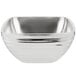 A silver stainless steel Vollrath square serving bowl with a curved edge and handles.
