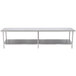 A long silver stainless steel table with two shelves.
