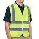 A man wearing a yellow Cordova lime high visibility safety vest.