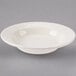 A Homer Laughlin ivory china soup bowl with a rolled edge.