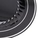 A close up of a Fineline black plastic plate with silver bands.