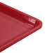 A close-up of a red Cambro dietary tray.