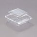 A Dart clear plastic container with a clear lid.