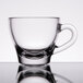 A clear glass Libbey espresso cup with a handle.
