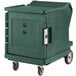 A green Cambro Camtherm low profile food holding cabinet on wheels.