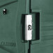 A close-up of a green plastic case with a latch.