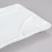 A white rectangular CAC divided sauce plate with a scalloped edge.