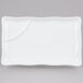 A white rectangular CAC divided sauce plate with a scalloped edge.