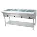 A large stainless steel Eagle Group open well hot food table with four compartments.