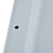 A close up of a white Rubbermaid tote box lid with a black circle