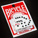 A package of red and white Bicycle dice.