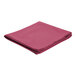 A folded mauve cloth table cover on a white background.