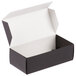 A black and white box with a white lid.