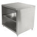 A stainless steel Advance Tabco cabinet base work table with a fixed mid shelf.