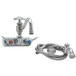 A T&S chrome wall mount faucet with a 7 7/8" hose and hand sprayer.