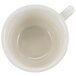 An Ivory (American White) short cup with an embossed rim and handle.