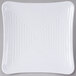 A white square Milano melamine plate with a spiral pattern.