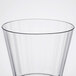 A clear plastic fluted tumbler with a rim.